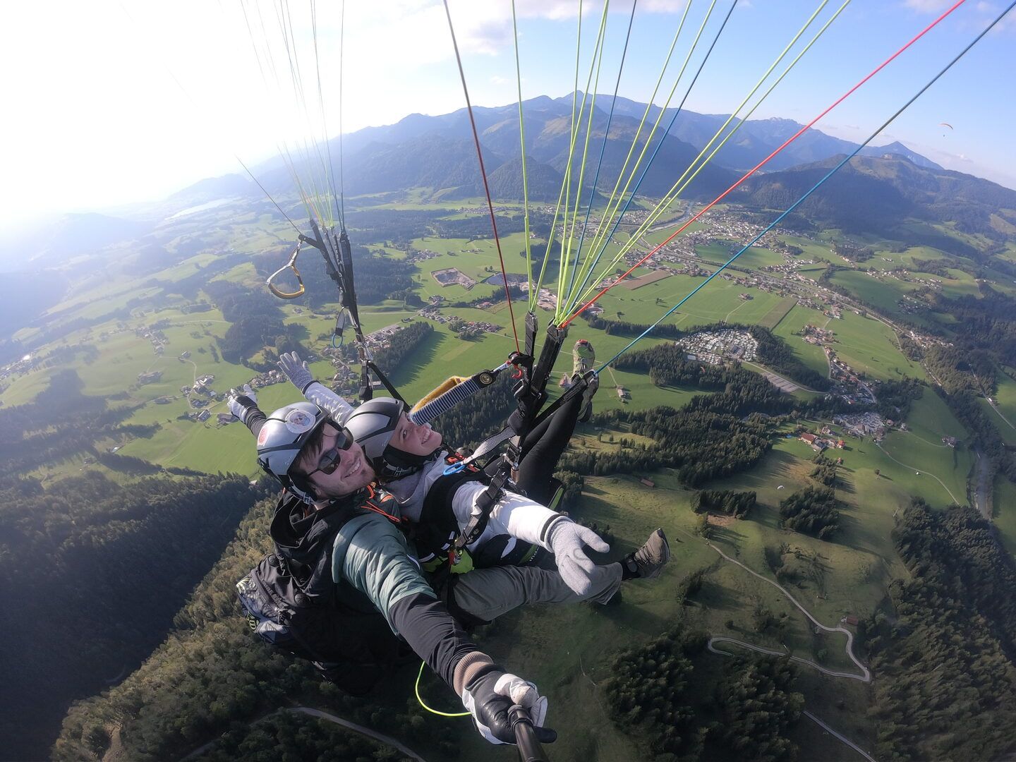 Jonathan Hoss tandem paragliding over Kössen with his girlfriend